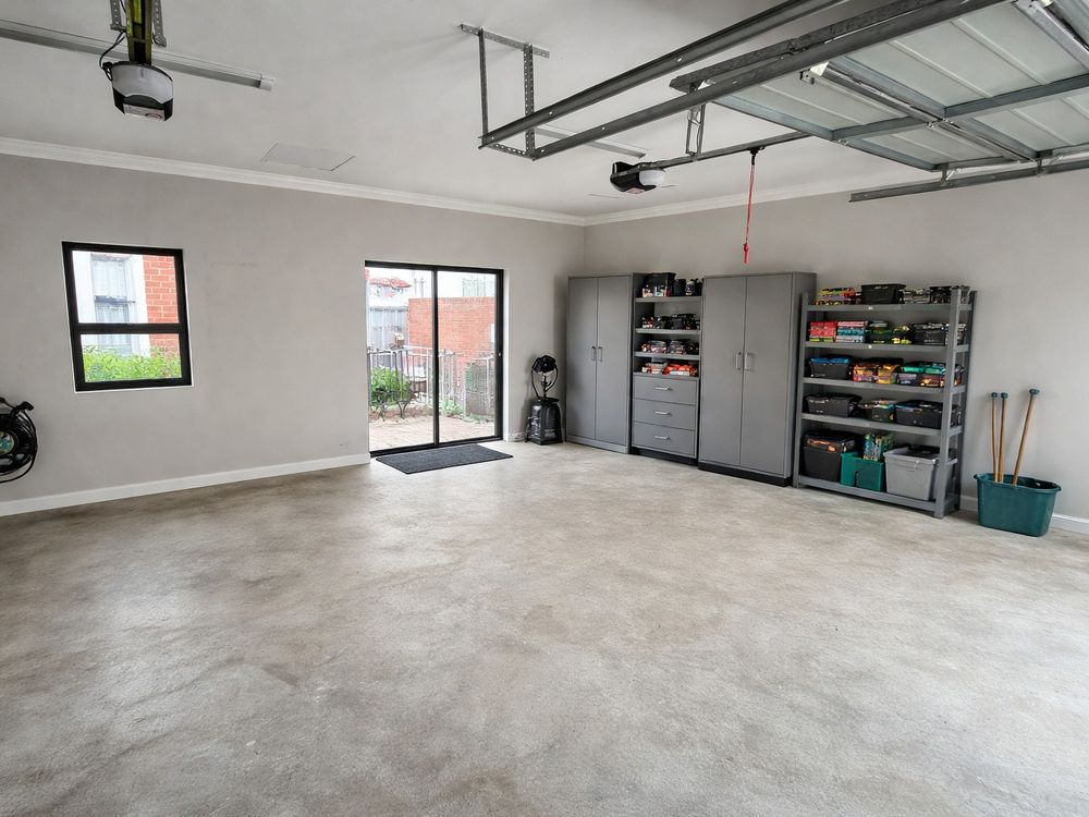 The same garage empty and swept after the clear-out