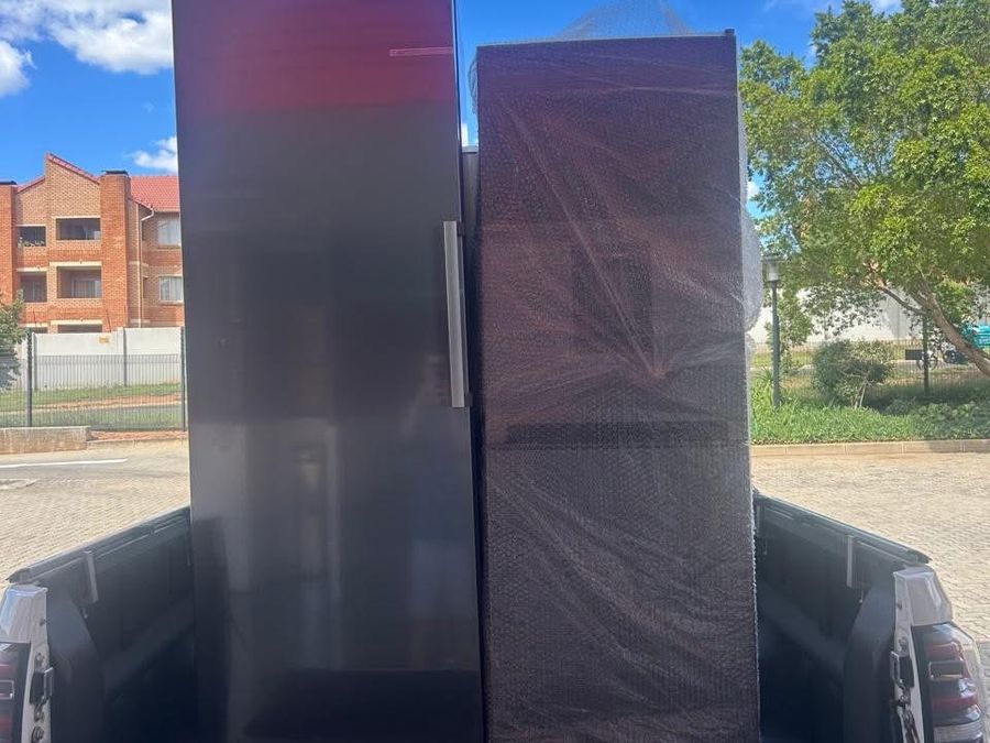 Two fridges loaded and strapped on a bakkie