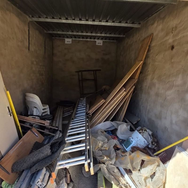 Storage unit full of timber, ladders and rubble